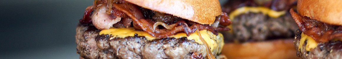 Eating American (New) Burger at Juicy Burger restaurant in Los Angeles, CA.